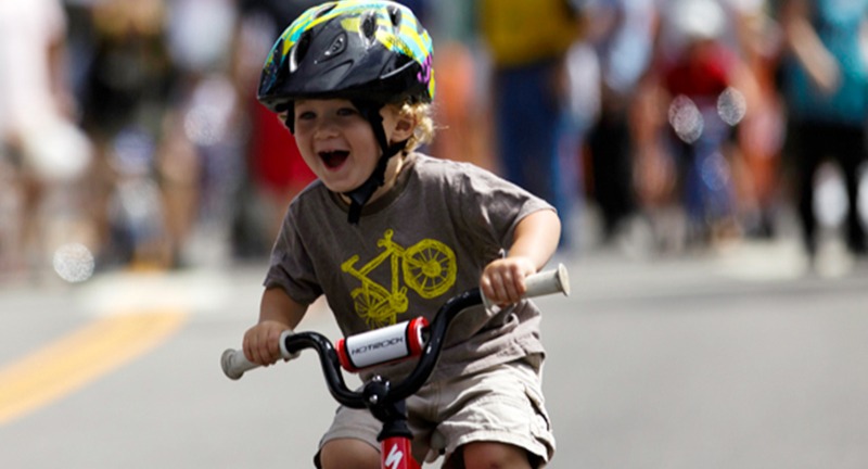 Kid riding a push bike