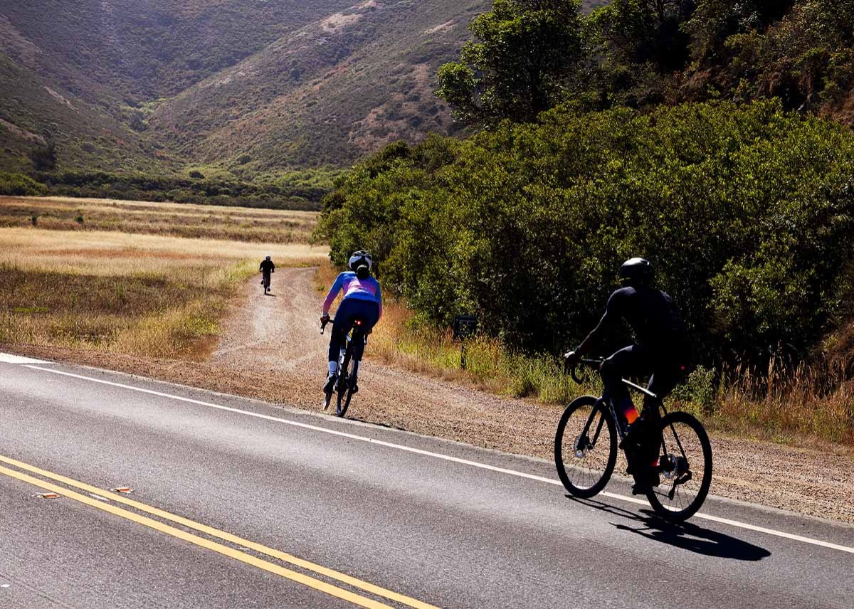 People riding gravel bikes transitioning from road to gravel.