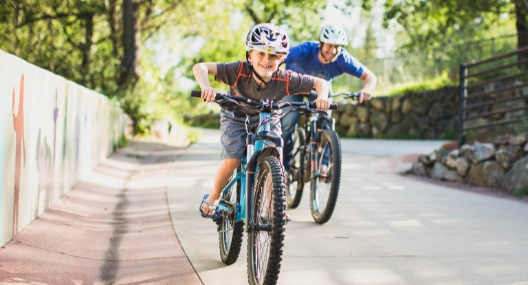 Father and son riding bikes