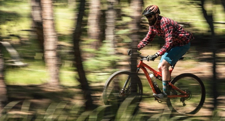 Mountain biker trail riding.