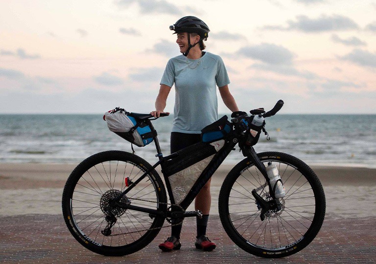 person with bike and bike frame bags