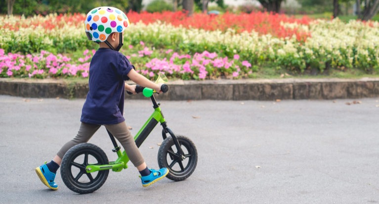 Child on balance bike