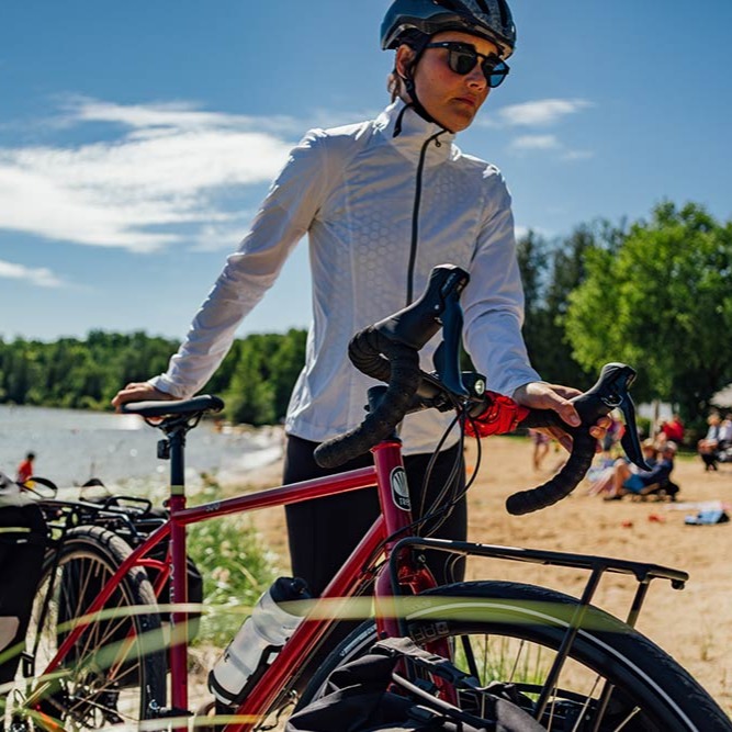 Rider standing with bike wearing bike apparel