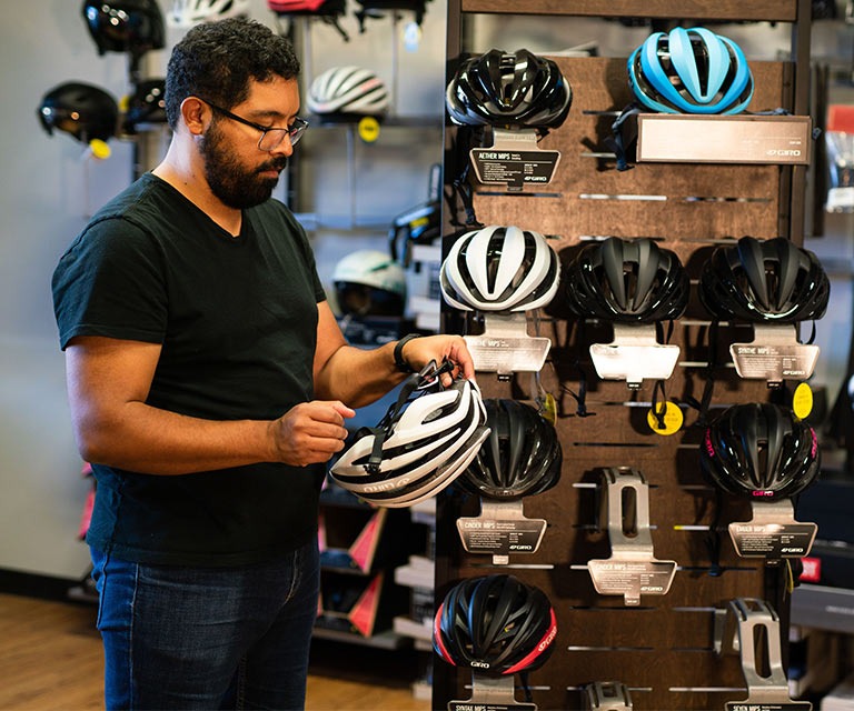 customer exploring helmets