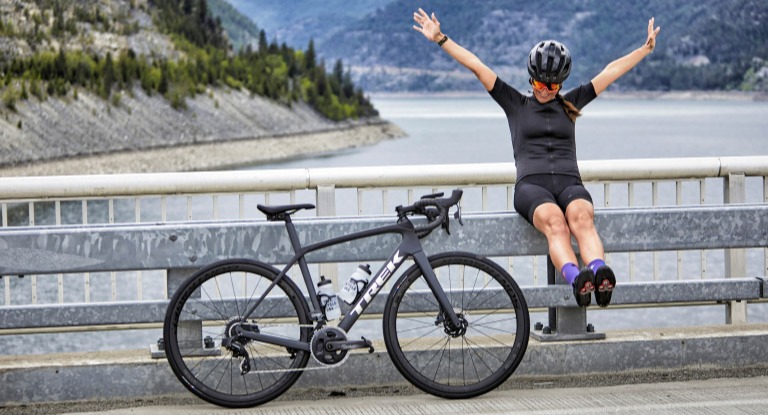 Girl excited next to bike