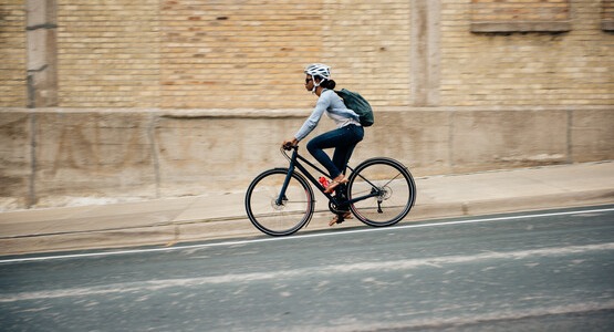 Woman riding hybrid bike