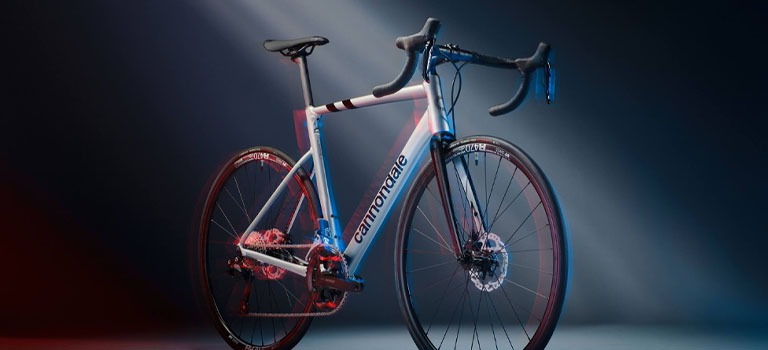 A bike rider riding a Cannondale Synapse Endurance Road Bike on a Trail