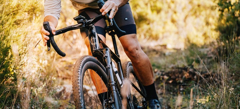 Cannondale Topstone bikes leaning against a brick wall