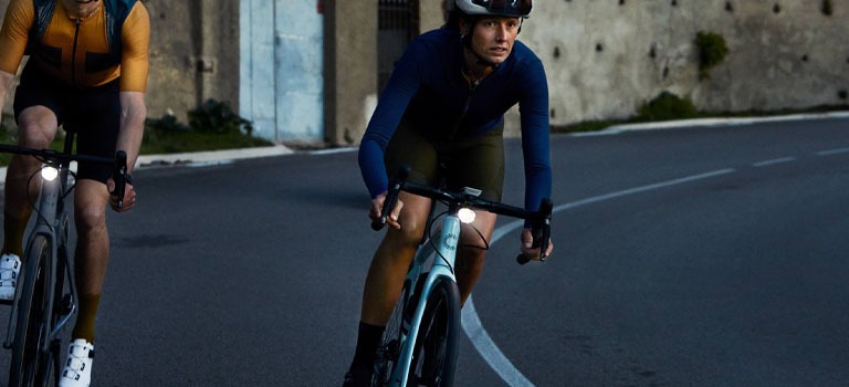 A bike rider riding a Cannondale Synapse Endurance Road Bike on a Trail