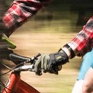 A bike rider wearing long fingered bicycle gloves