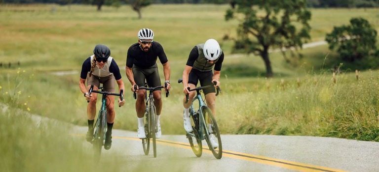 A bike rider riding a Cannondale Synapse Endurance Road Bike on a Trail