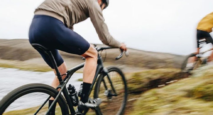A bike rider on a Specialized Diverge 4 gravel bike on a trail road
