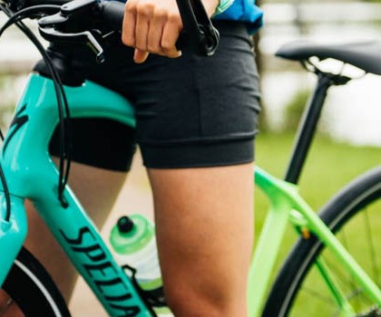Woman Cyclist on a Green Specialized Bike