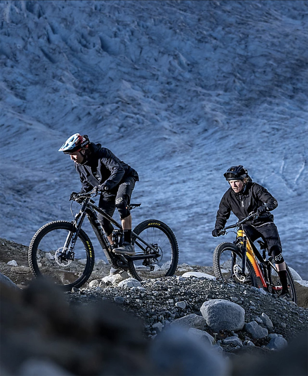 two riders riding electric mountain bikes
