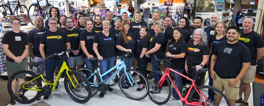 Orange Cycle staff in showroom