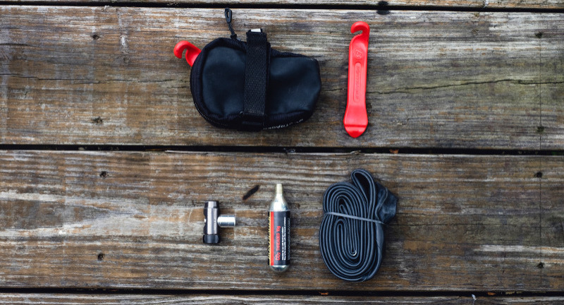 Essential Gear (Image features a variety of bicycle repair items)
