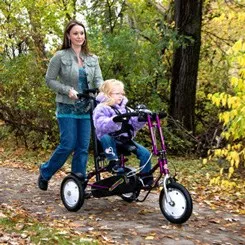 Women and child riding Freedom concepts dcp 12 trike