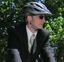 "bike commuter with helmet on"