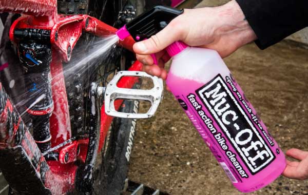 "Muc-Off bike cleaner spraying mountain bike"