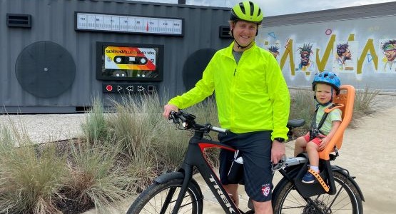 TIm Robinson and child on bike