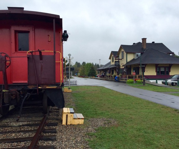 A renovated train station and caboose on the Petite Train du Nord
