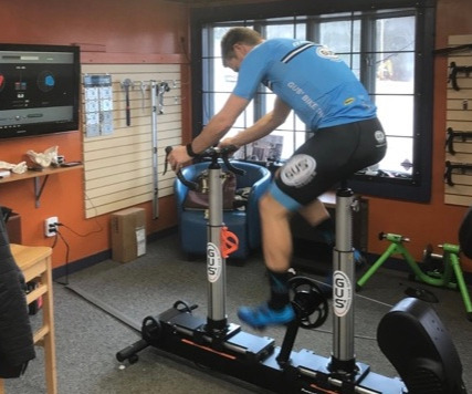 Rider on the fit bike in Gus' Fit Studio