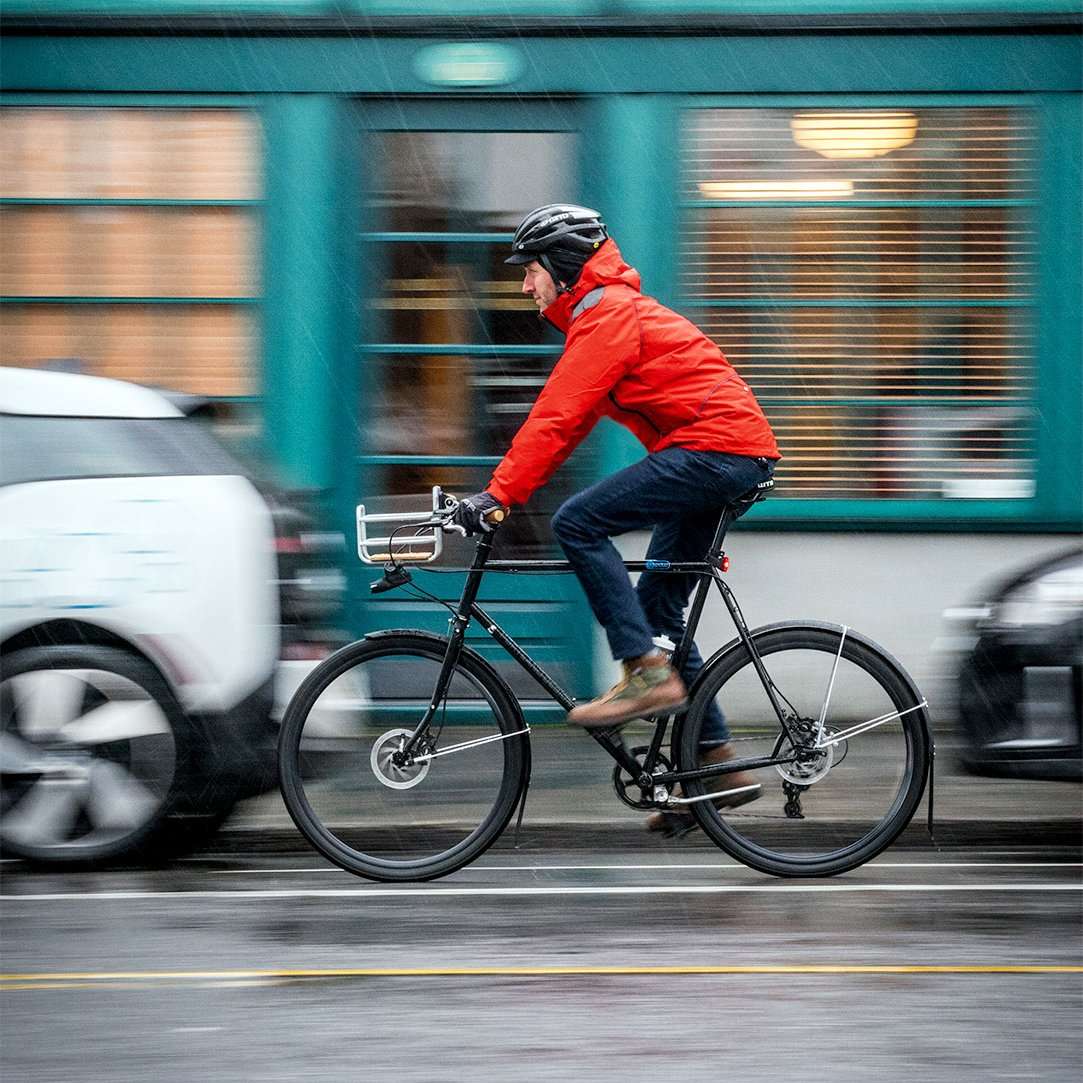 man wearing rain cycling gear