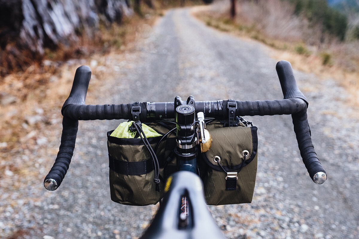 Dark green Kestrel handelbar bag on bike rearview