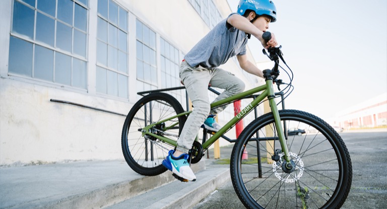 Boy on 24-inch kids' bike