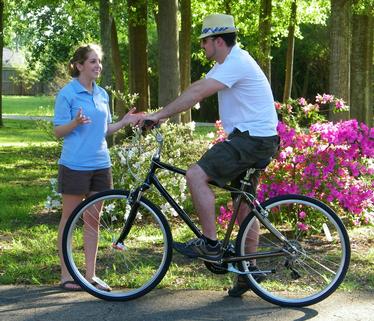 Woman helping man with a test ride