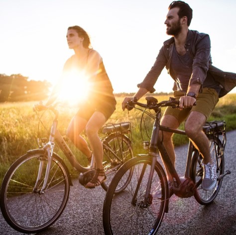 Image of two people riding bikes recreationally