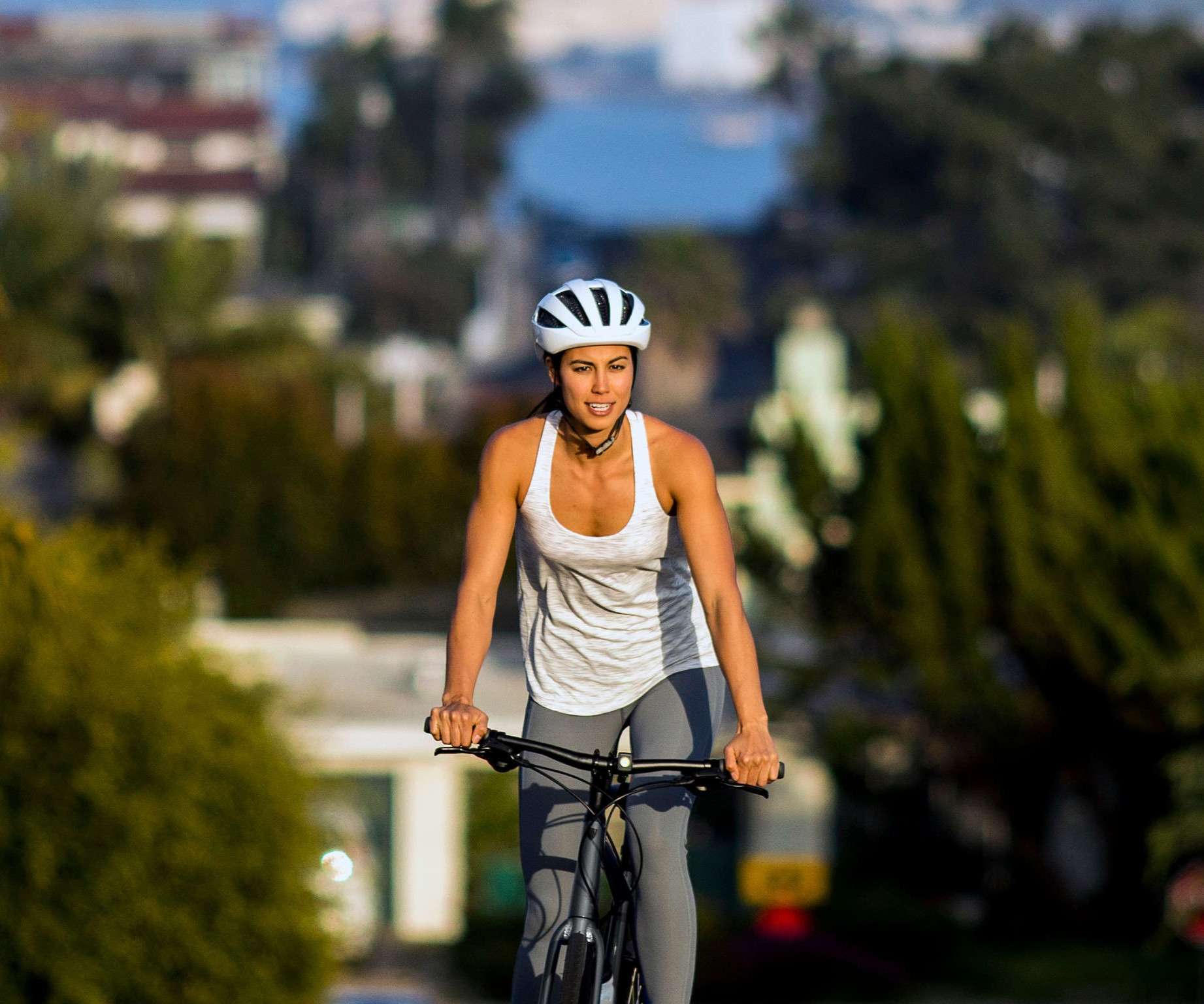 Image of a woman riding a hybrid bike