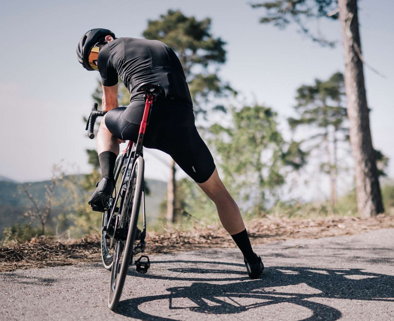 image of a person on a road bike, posing