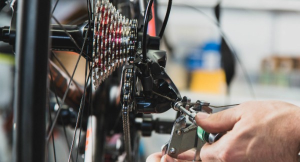 mechanic repairing bike