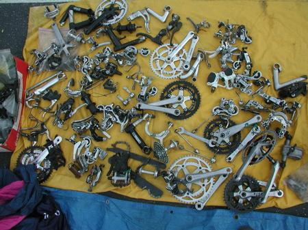 Bike parts spread out on a blanket