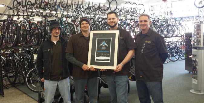 1 World 2 Wheels - 2014 Game Changer awarded to Bickel's Cycling & Fitness