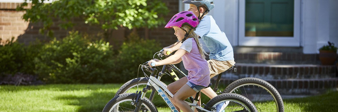 boy and girl riding their bikes