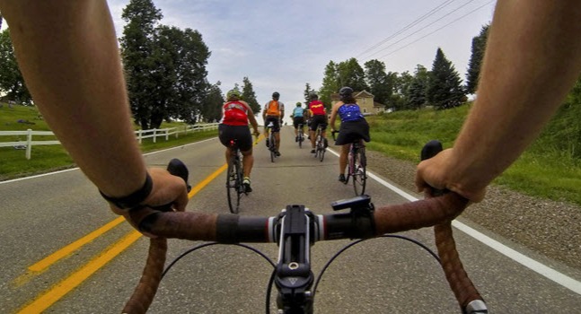 group of cyclists riding