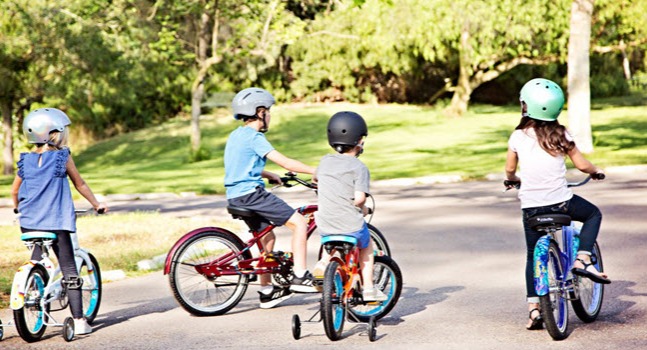 group of kids riding their bikes