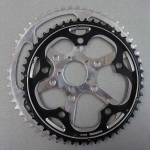 Which chainring will make you go faster, the larger one or the smaller one (which came stock on your bike)? Answer: The smaller one.