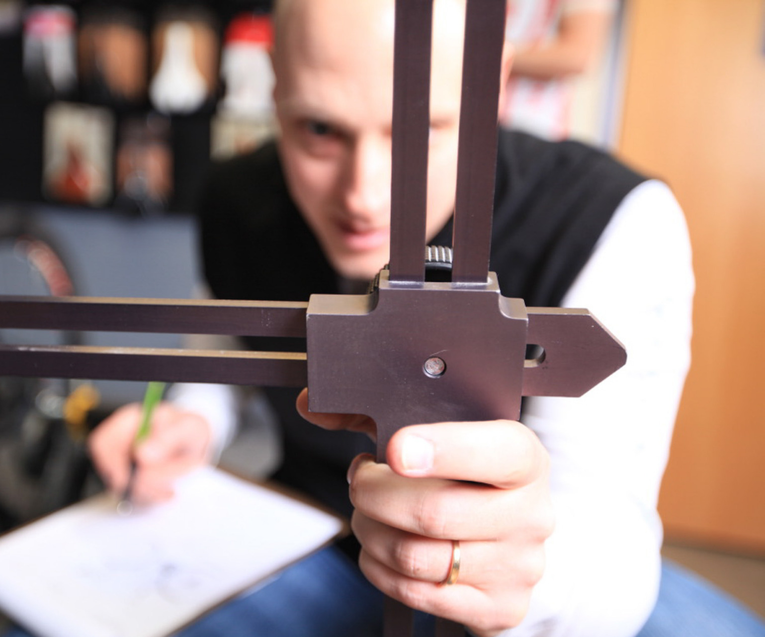 Person holding bicycle fitting tools