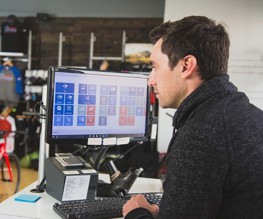 Man sitting at desk by computer.