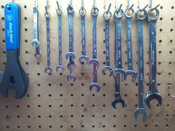 Variety of wrenches on pegboard