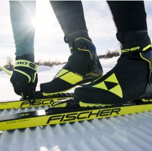 close up of Fischer skis, bindings & boots