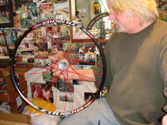 Master Wheel-Builder In-House, Jerry sitting with a wheel