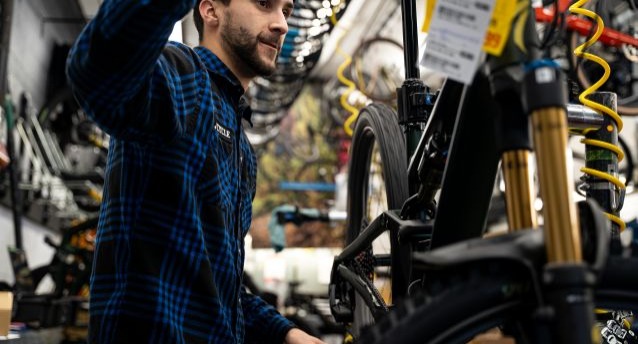 Mechanic tuning a bicycle