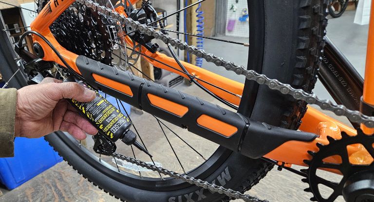 Lube chain with Muc-off Dry Lube