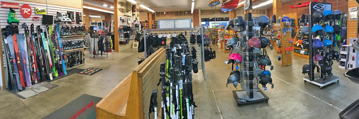 Peak Sports Outdoor Store sales floor with various ski and snowboard gear displayed