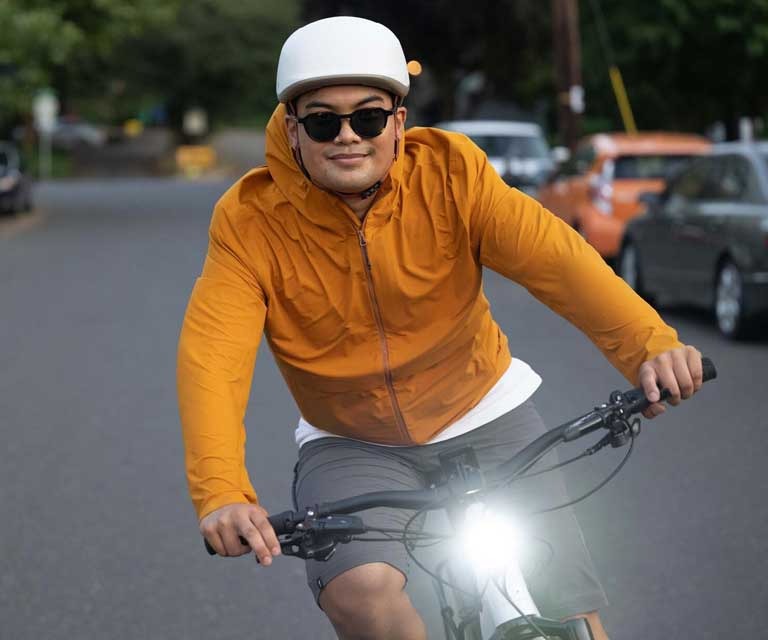 Two people riding hybrid bikes