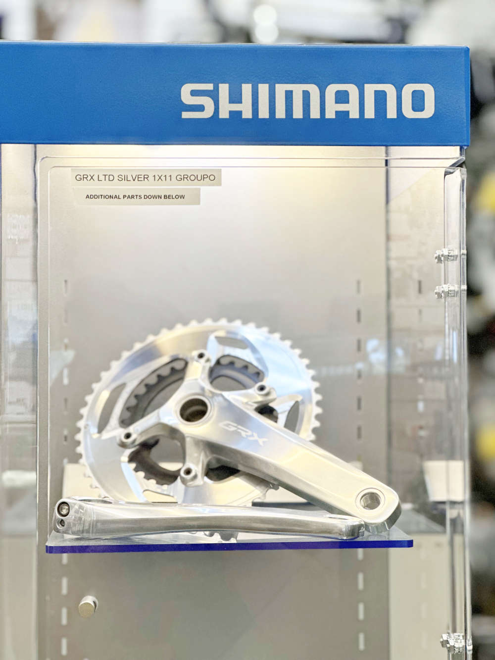 A GRX Crank on display in a Shimano parts case.